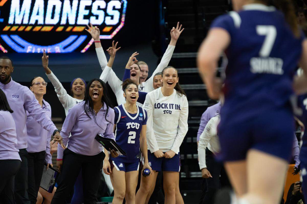 The TCU bench cheers after a basket in the Elite Eight of the NCAA Tournament on Monday at Golden 1 Center in Sacramento, Calif.