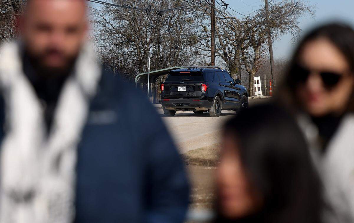 An Alvarado police cruiser patrols the road leading to the Prairieland Detention Facility as family and supporters hold a press conference demanding the release of Leqaa Kordia on Friday, Jan. 30, 2026.