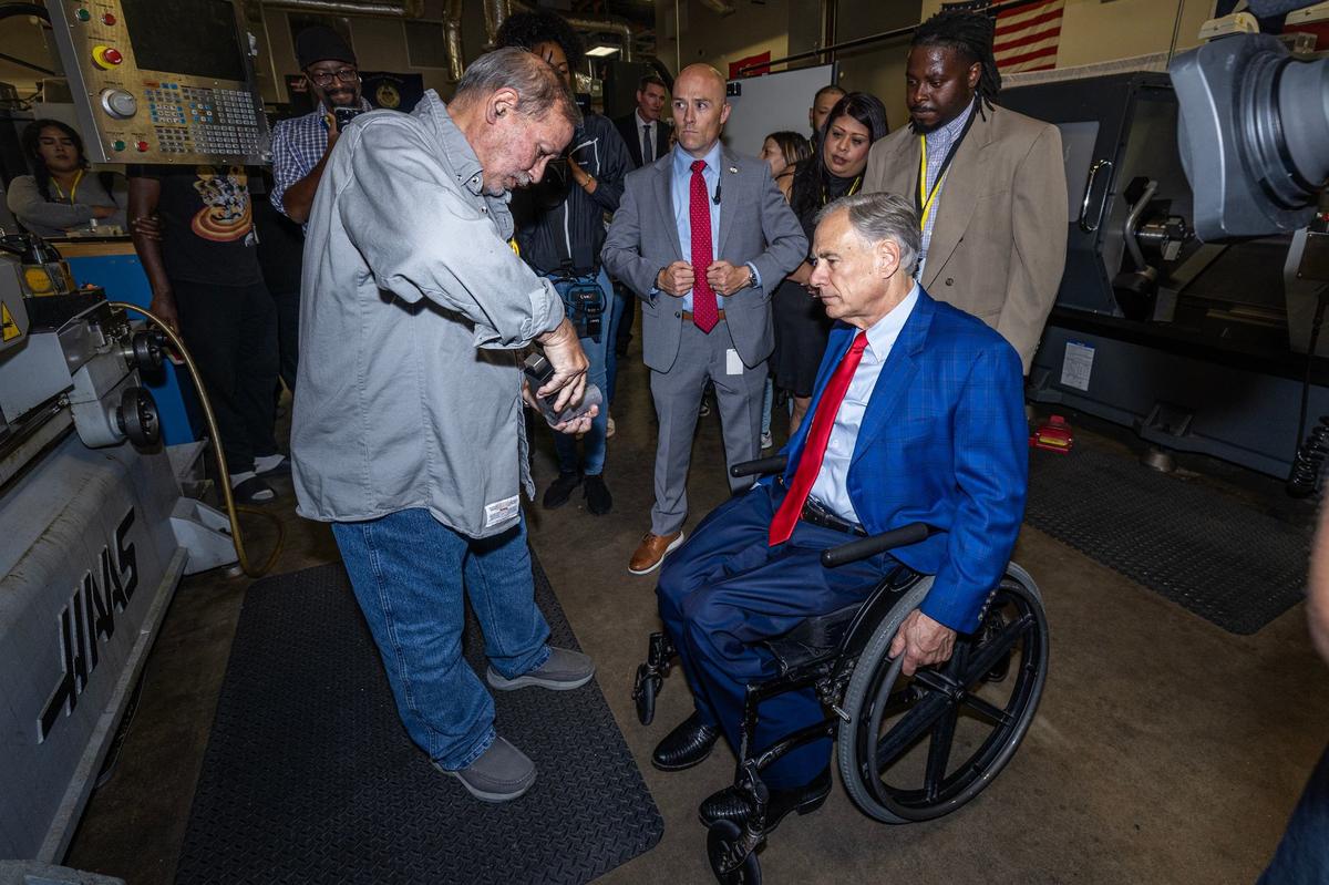 Thomas Ford, an instructor at New Heights Adult High School, displays welding parts to Texas State Governor Greg Abbott during a campus tour prior to the grand opening ceremony of the New Heights Adult High School at the Tarrant County College Opportunity Campus in Fort Worth on Wednesday, Sept. 25, 2024. New Heights is the first dual enrollment adult high school in Texas.