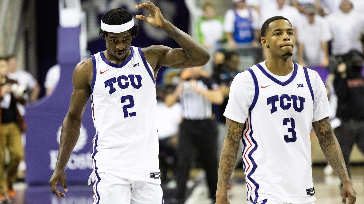 TCU’s Emanuel Miller (2) and Avery Anderson (3) exit the game following a loss to the Texas Longhorns at Schollmaier Arena on Saturday.