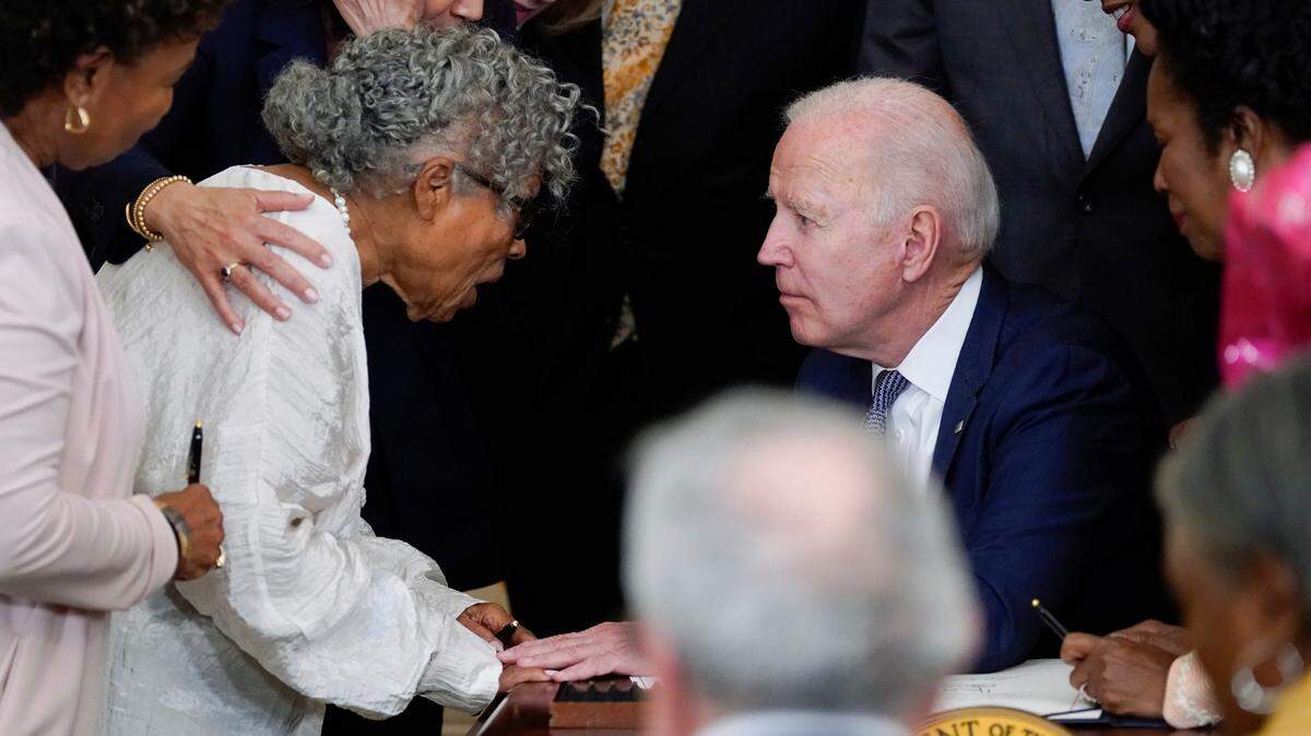 Fort Worth activist Opal Lee speaks with President Joe Biden after he signed the Juneteenth National Independence Day Act on June 17, 2021. Lee was instrumental in the effort to make Juneteenth a federal holiday.
