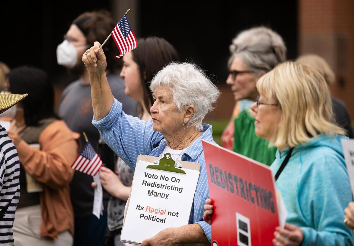Community members rally outside of the G.K. Maenius Administration Building on Tuesday, June 3, 2025, to protest the proposed redistricting of Tarrant County. The Tarrant County Commissioners Court will vote on Tuesday on a the proposal to redraw precinct boundary lines.