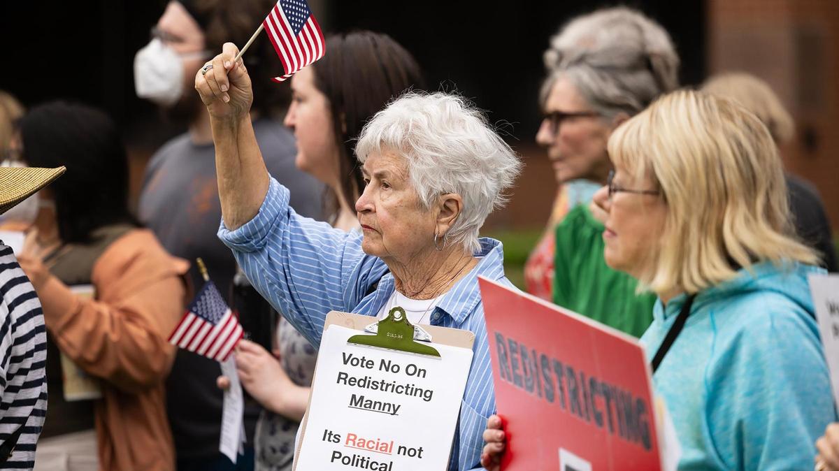 Community members rally outside of the G.K. Maenius Administration Building on Tuesday, June 3, 2025, to protest the proposed redistricting of Tarrant County. The Tarrant County Commissioners Court will vote on Tuesday on a the proposal to redraw precinct boundary lines.