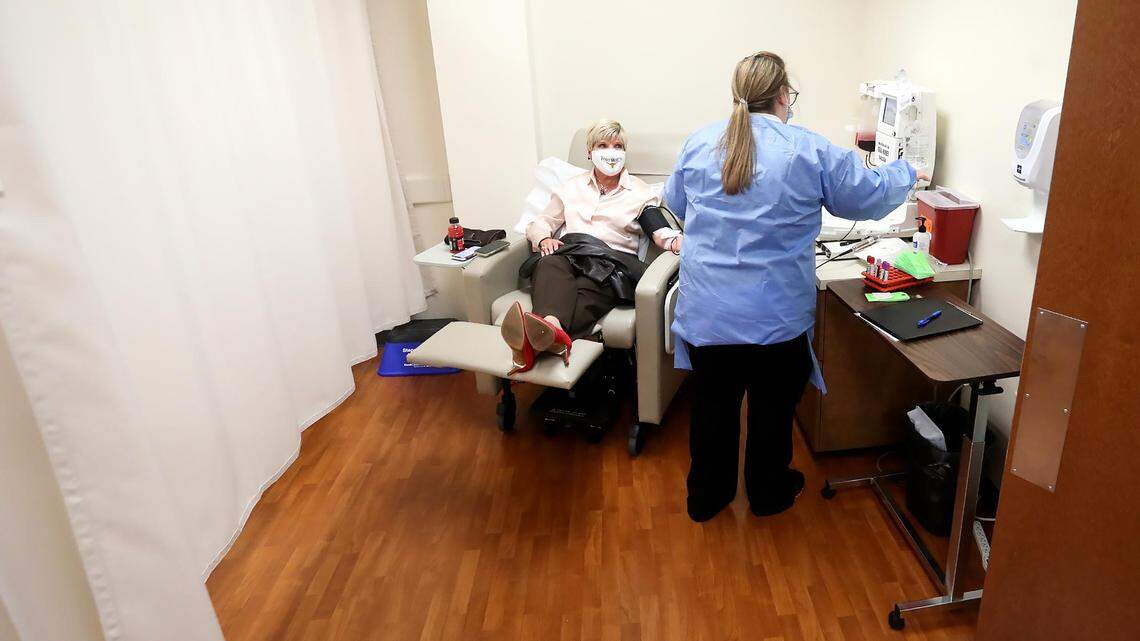 Carter BloodCare phlebotomist Rachel Walter, right, takes Fort Worth Mayor Betsy Price’s COVID-19 convalescent plasma donation on Friday, Those who have had COVID-19 and have been symptom-free for 14 days can donate CCP to help patients hospitalized with COVID-19.