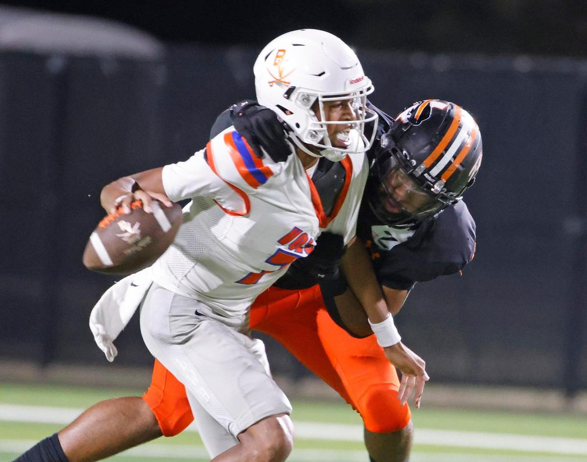 Haltom defensive lineman Damien Wayne (11) sacks Bowie quarterback Larry Nichols (7) during a District 8-6A football game at Birdville Fine Arts/Activity Complex in North Richland Hills, Texas, Friday, Oct. 25, 2024.