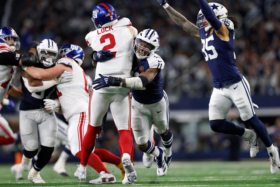 Dallas Cowboys defensive end Micah Parsons sacks New York Giants quarterback Drew Lock in the third quarter against the New York Giants on Thursday, Nov. 28, 2024, at AT&T Stadium in Arlington.