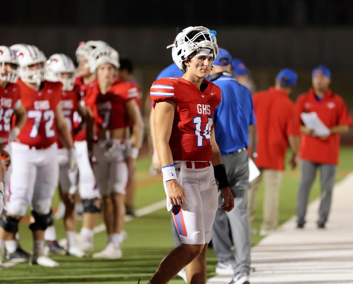 Grapevine quarterback Harrison Hackbarth (14) watches the final seconds tick off the clock in the second half of an UIL football game at Mustang-Panther Stadium in Grapevine, Texas, Thursday Aug. 24, 2023. Wakeland defeated Grapevine 21-13.