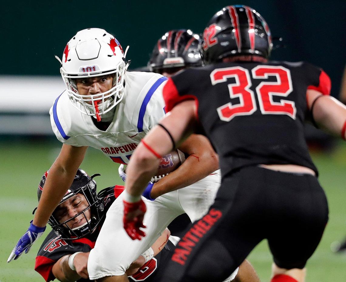 Grapevine tight end Matthew Debrei (45) attempts to avoid the tackle of Colleyville Heritage linebacker Luke Lingard (32) during a high school football game at Globe Life Park in Arlington, Texas, Saturday, Sept. 26, 2020. Colleyville led 28-24 at the half. (Special to the Star-Telegram Bob Booth)