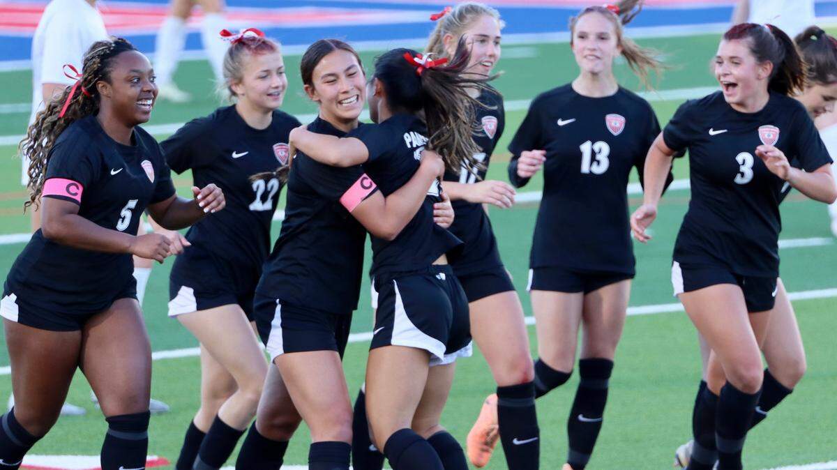 The Colleyville Heritage girls soccer team celebrates in a win during an undefeated run to the state semifinals in Georgetown, Texas.