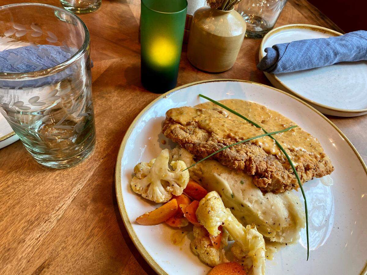 Chicken-fried steak with housemade smoked-sausage gravy at 97 West.