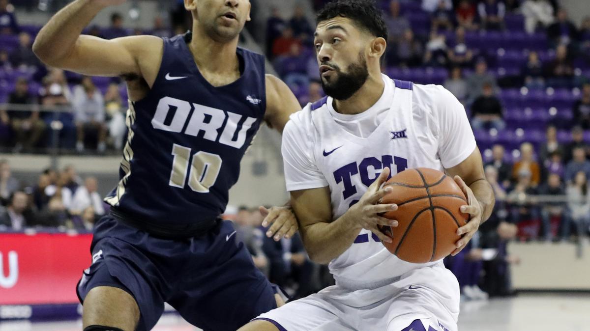Oral Roberts guard Sam Kearns (10) defends TCU  guard Alex Robinson (25) at the net during the first half of a NCAA mens basketball game at Schollmaier Arena in Fort Worth, Texas, Sunday, Nov. 11, 2018. TCU led 37-28 at the half. (Special to the Star-Telegram Bob Booth)

