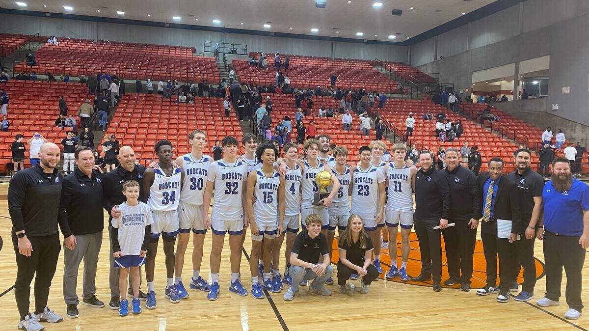 Byron Nelson posing with the trophy after beating Hebron 54-43 in the 6A Region 1 District Semi-Finals
