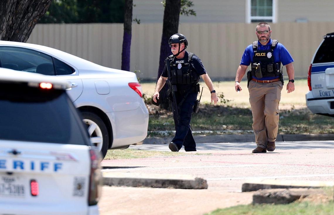 Law enforcement responds to the scene where a Tarrant County sheriff’s deputy was shot three times in Fort Worth on Wednesday, August 7, 2024. The deputy was shot while serving three felony warrants related to the sexual assault of a child, authorities said.