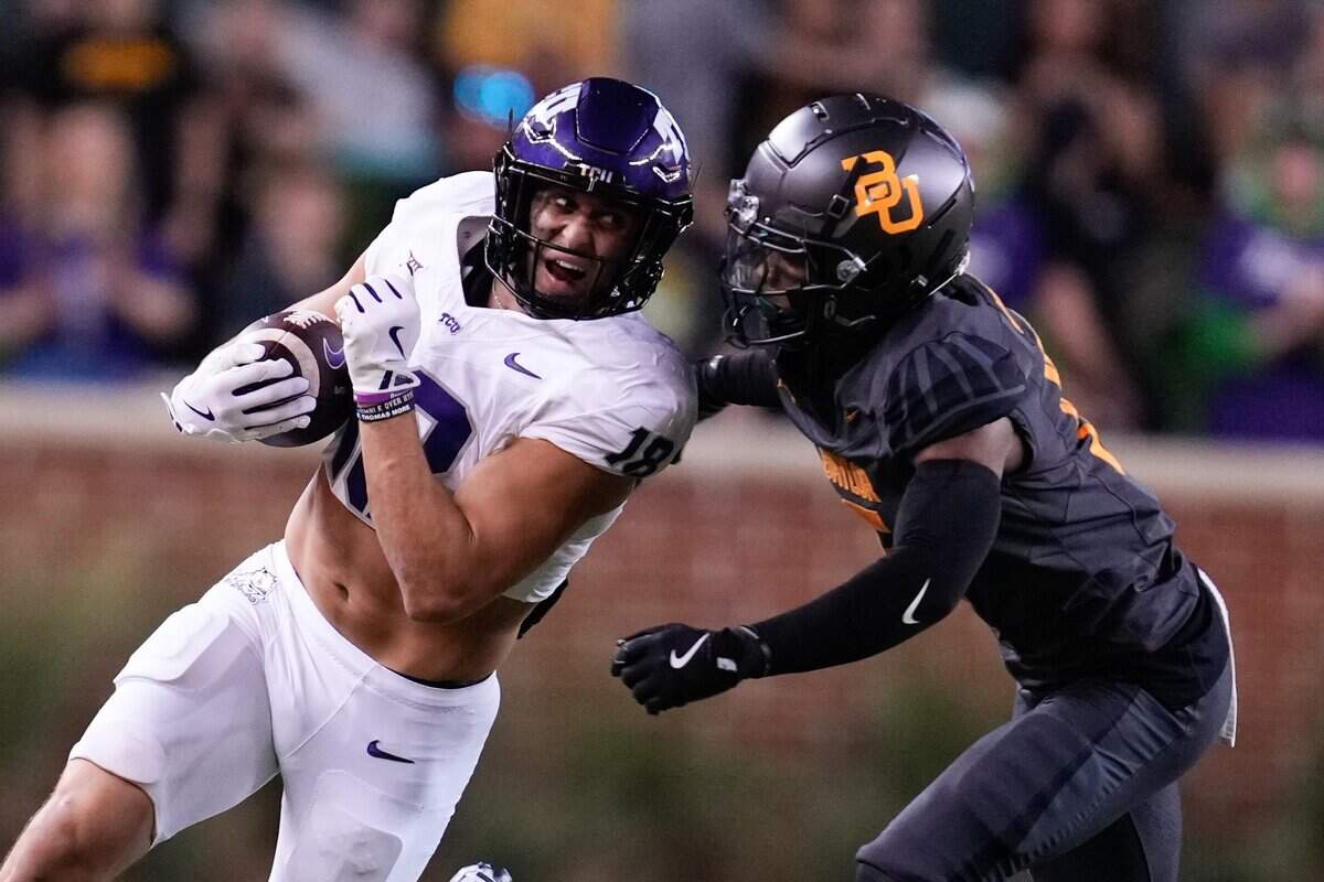 Nov 2, 2024; Waco, Texas, USA; TCU Horned Frogs quarterback Josh Hoover (10) runs the ball aganst Baylor Bears safety Carl Williams IV (15) during the first half at McLane Stadium. Mandatory Credit: Chris Jones-Imagn Images
