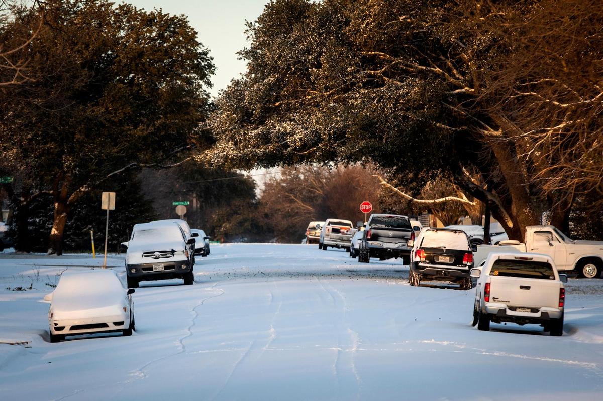 Snow covers the streets after a storm Monday, Feb. 15, 2021, in Fort Worth. Hard freeze and wind chill warnings were in effect.