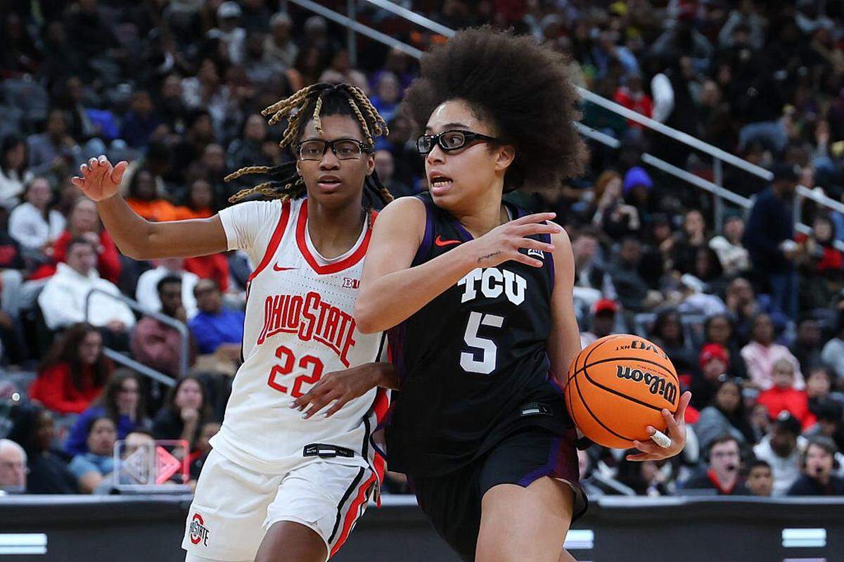 NEWARK, NEW JERSEY - JANUARY 19: Olivia Miles #5 of the Texas Christian University Horned Frogs dribbles the ball as Jaloni Cambridge #22 of the Ohio State Buckeyes defends during the second half of the Coretta Scott King Classic at Prudential Center on January 19, 2026 in Newark, New Jersey. (Photo by Ed Mulholland/Getty Images)