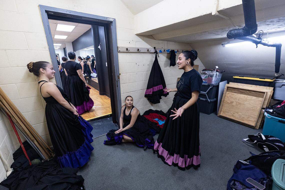 Isabella Maschino, Joanna Gonzales, and Crystal Sanchez share a laugh in the doorway leading to the studio.