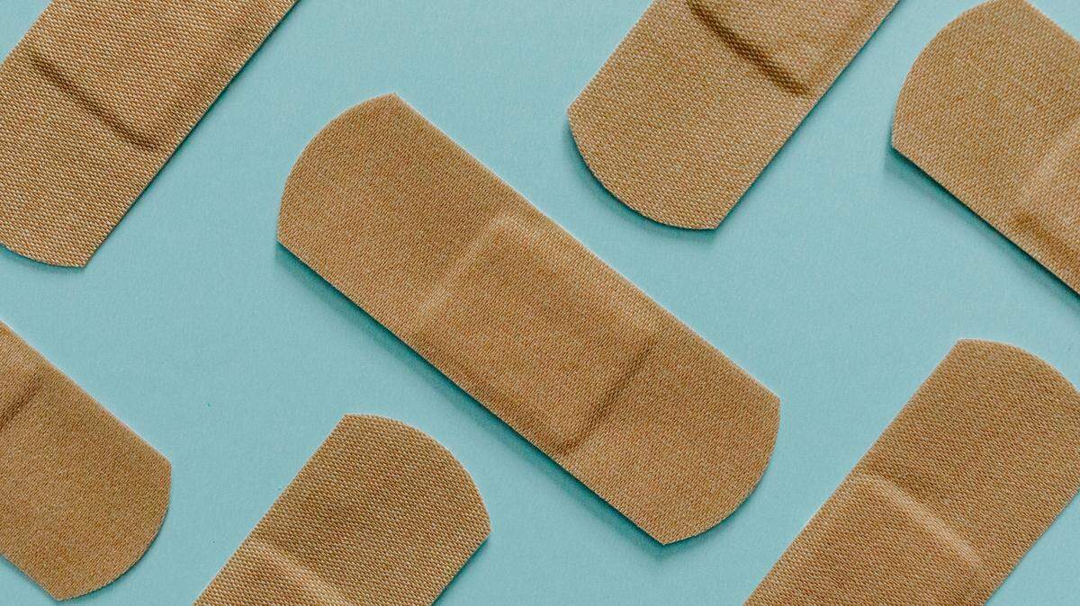 Band-Aids on a blue background.