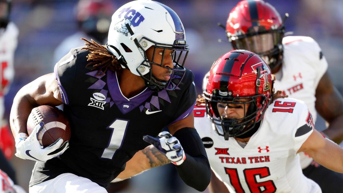 TCU wide receiver Quentin Johnston (1) rounds the right side pursued by Texas Tech defensive back Thomas Leggett (16) during the first half of a NCAA college football game at Amon G. Carter Stadium in Fort Worth, Texas, Saturday, Nov. 07, 2020. TCU had a seven point lead at the half. (Special to the Star-Telegram Bob Booth)