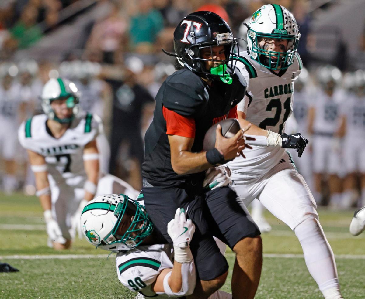 Trinity quarterback TJ Tupou (8) is stopped one yard short of the goal line by Southlake defensive lineman Austin Davidge (90) during a UIL 6A Conference football game at Pennington Field in Bedford Texas, Friday, Sept. 20, 2024.