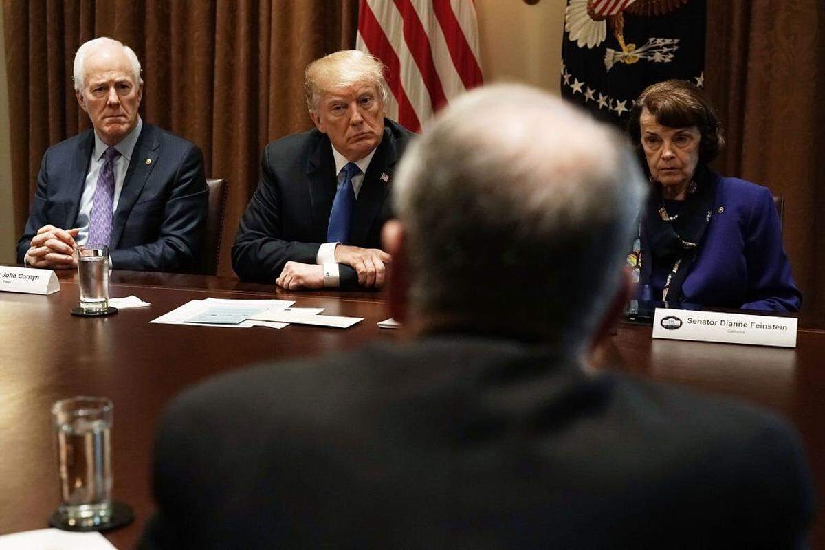 WASHINGTON, DC - FEBRUARY 28: U.S. President Donald Trump (2nd L), Senate Majority Whip Sen. John Cornyn (R-TX) (L) and Sen. Dianne Feinstein (D-CA) (R) listen during a meeting with bipartisan members of the Congress at the Cabinet Room of the White House February 28, 2018 in Washington, DC. President Trump held a meeting with lawmakers to discuss school and community safety. (Photo by Alex Wong/Getty Images)