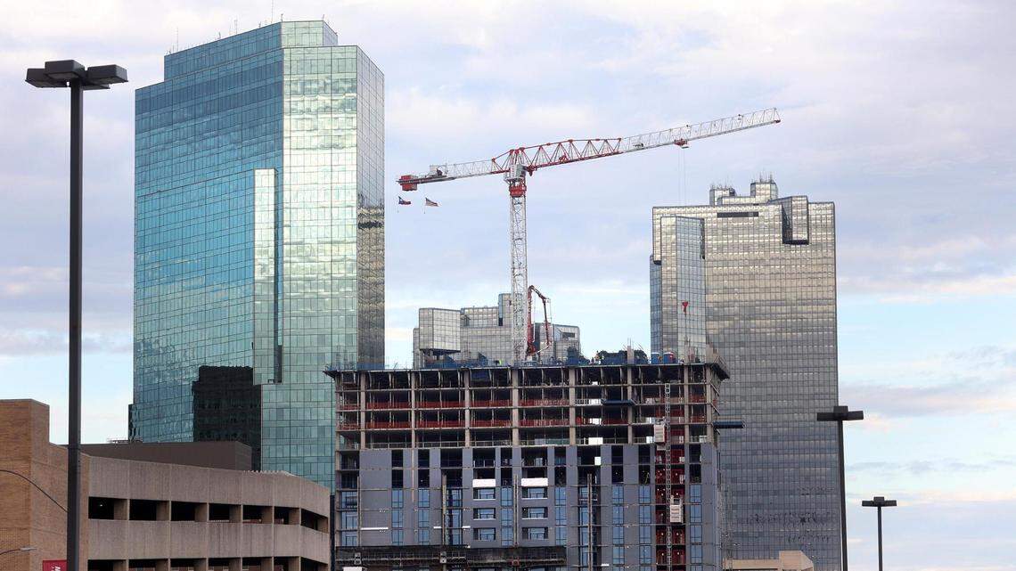 A crane can be seen atop what will be Deco 969, the apartment tower under construction in downtown Fort Worth, on Dec. 6. Deco 969 will have 27 stories of luxury apartments.