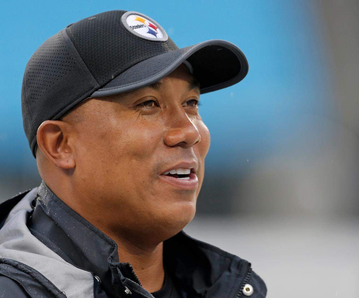 FILE - In this Thursday, Aug. 31, 2017, file photo, former Pittsburgh Steelers wide receiver Hines Ward walks the sidelines before an NFL preseason football game against the Carolina Panthers in Charlotte, N.C. On Tuesday, Nov. 27, 2018, the Alliance of American Football, an eight-team spring league that begins play the weekend after the Super Bowl, will stage a “protect or pick” quarterback draft. Ward, the Alliance’s head of football development, will be the host, and the biggest name in the proceedings. (AP Photo/Bob Leverone, File)