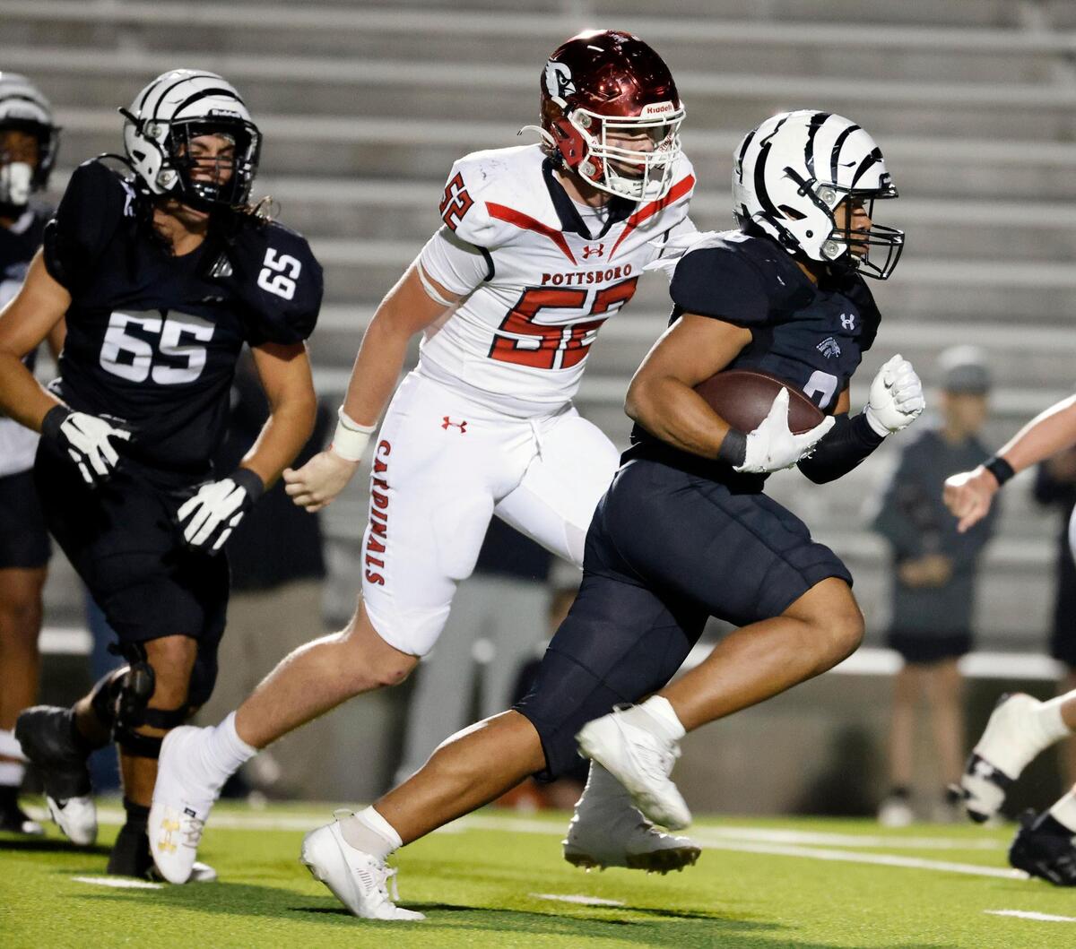 Grandview running back Casey Cannon (8) races ahead of Pottsboro lineman Barrett Dudley (52) in the second half of a UIL Class 3A Division 1 area round playoff football game at Mesquite Memorial Stadium in Mesquite, Texas, Thursday, Nov. 16, 2023.