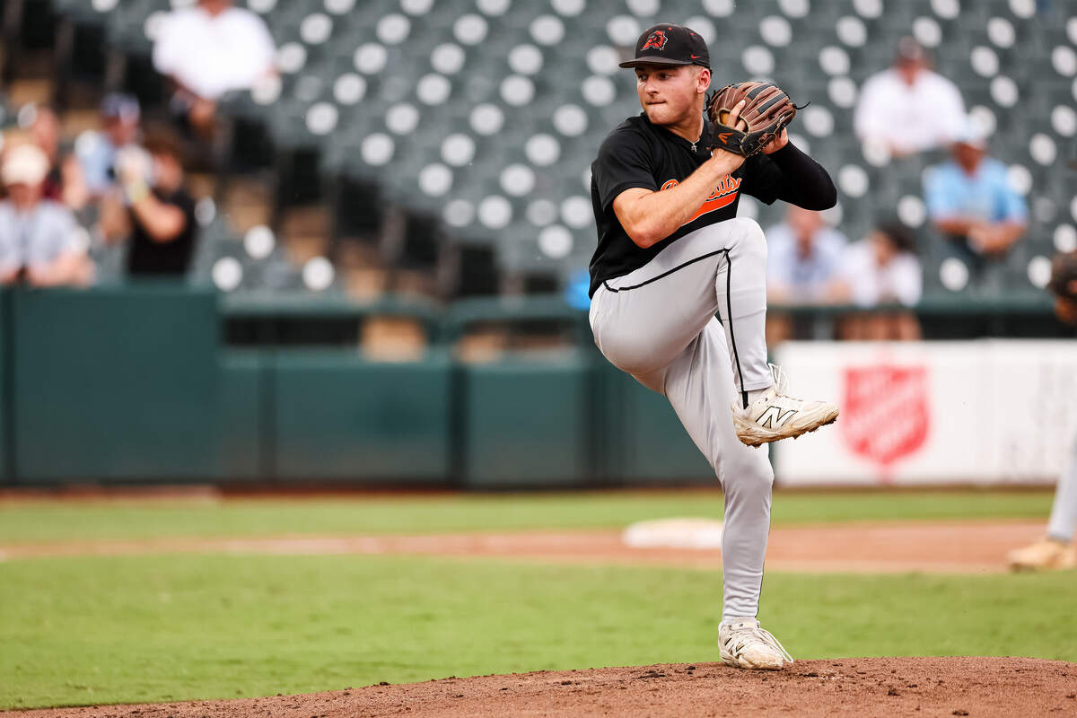 Aledo pitcher Lucas Nawrocki (61) kicks his leg up in attempt to throw a pitch against Montgomery Lake Creek in the UIL Class 5A Division I baseball state championship game on Friday, June 5, 2026, at Dell Diamond in Round Rock, Texas.