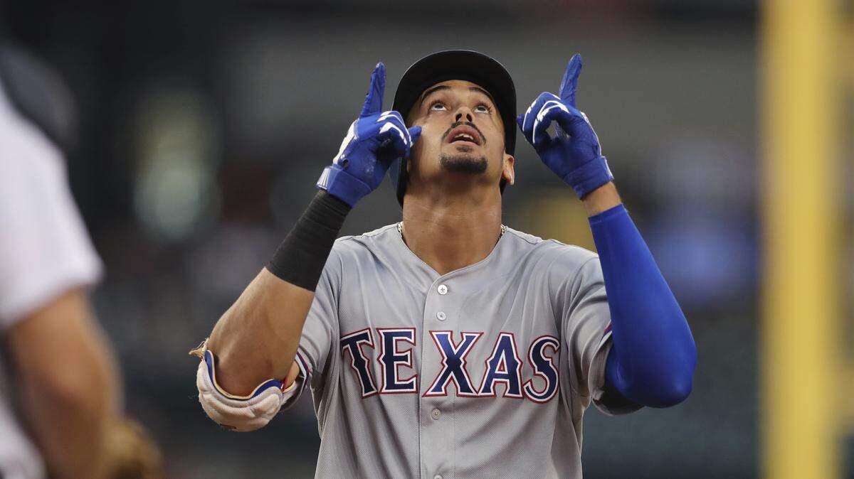 Texas Rangers' Ronald Guzman looks skyward as he crosses home plate after his two-run home run during the fourth inning against the Detroit Tigers in a baseball game Thursday, July 5, 2018, in Detroit. (AP Photo/Carlos Osorio)