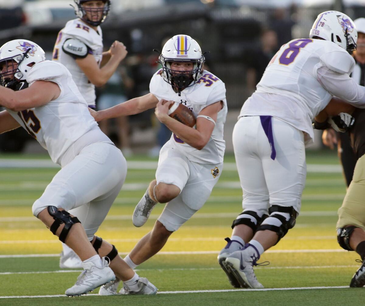 Grandbury’s Gage Archer finds running room in the Birdville defense during their game Thursday night at Birdville Athletic Center. JOHN ROWLAND