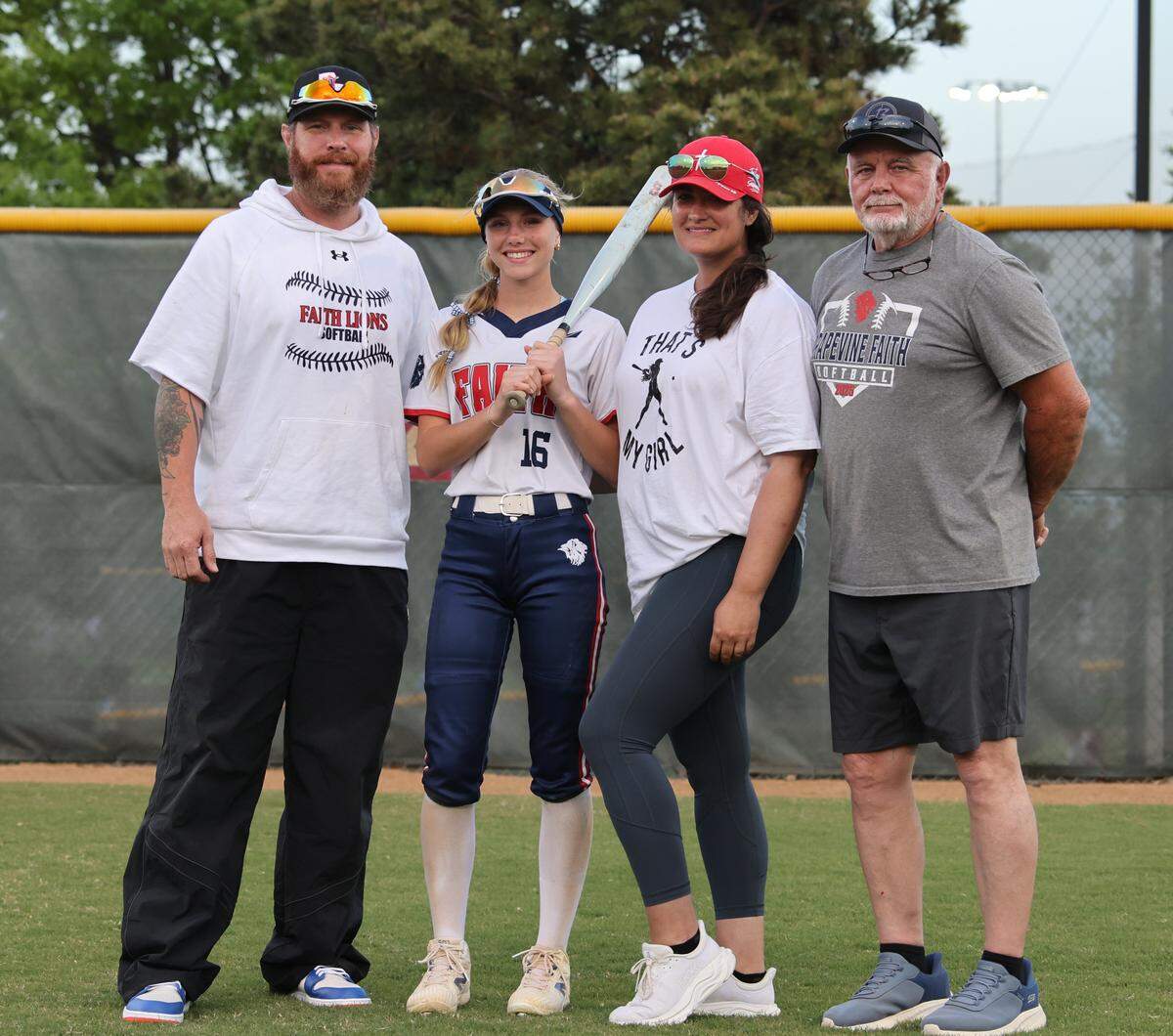 Grapevine Faith center fielder Michaela Hamilton is photographed with her dad, former Texas Rangers outfielder Josh Hamilton, his wife Rachel and his father Tony after winning a softball game at Oak Grove Park in Grapevine, Tx. Tuesday, March 31, 2026
