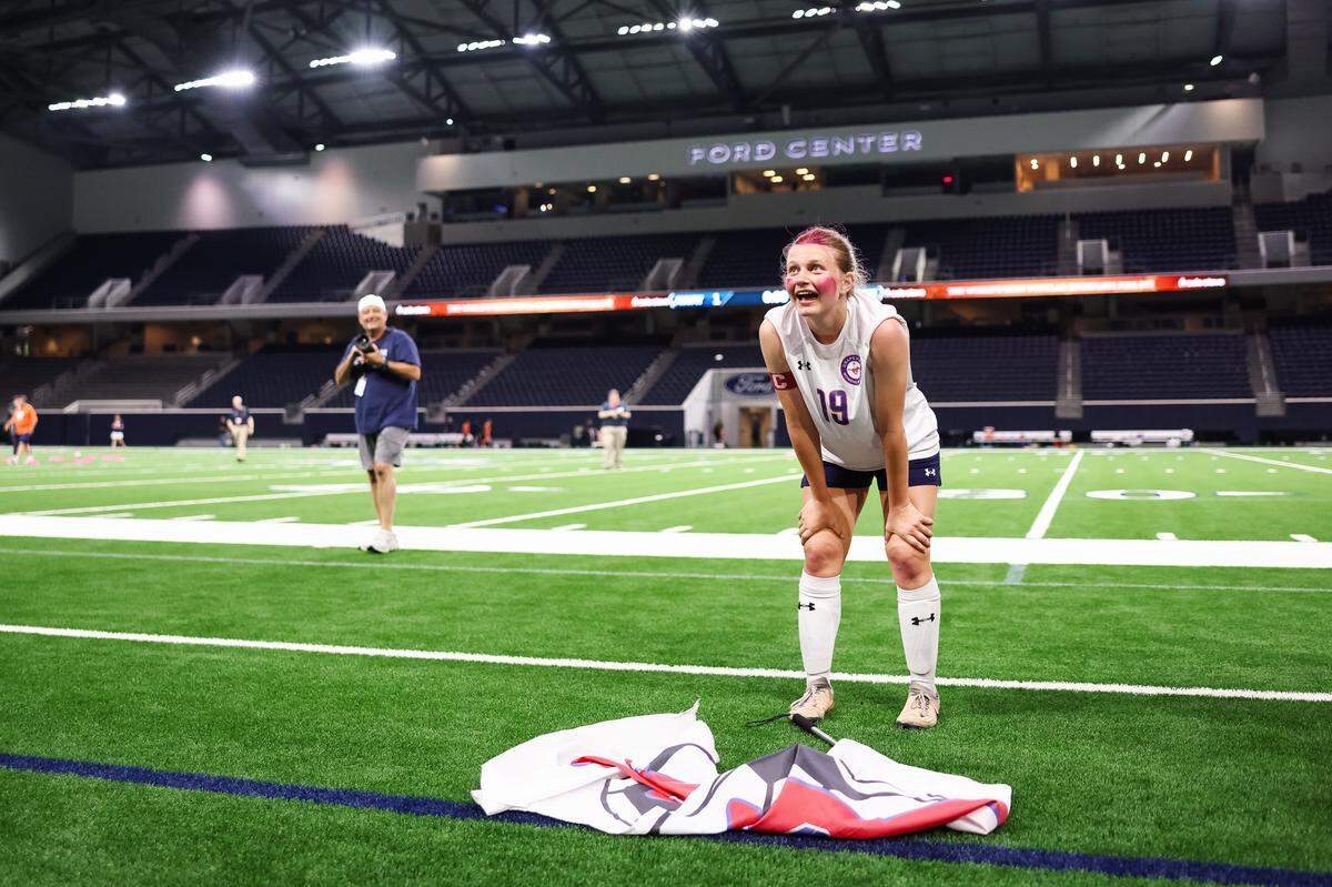 Grapevine defender Makena Kerr (19) puts her hands on her knees staring into the crowd in disbelief after defeating Frisco Wakeland in a Class 5A Division  IIUIL girls soccer state semifinal at the Ford Center on April 3, 2026 in Frisco, Texas.