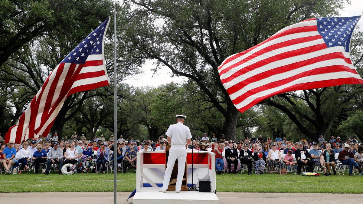 U.S. Navy Captain Mark McLean delivers the key note to a full gallery during The 93rd Fort Worth Memorial Day Service at Mount Olivet Cemetery in Fort Worth, Texas, Monday, May 30, 2022. Judge Glen Whitley introduced McClean as the best Texas Commander of Naval Air Station Joint Reserve Base of Fort Worth. (Special to the Star-Telegram Bob Booth)