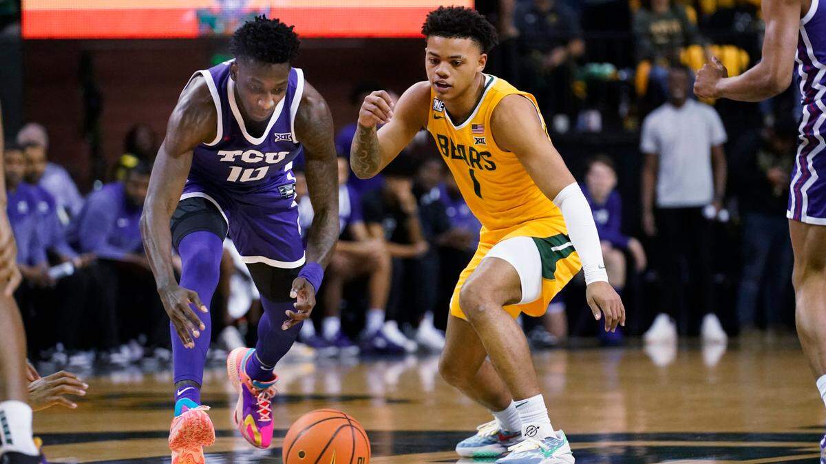 Baylor guard Keyonte George (1) and TCU guard Damion Baugh (10) chase the ball during their game in Waco, on Jan. 4.