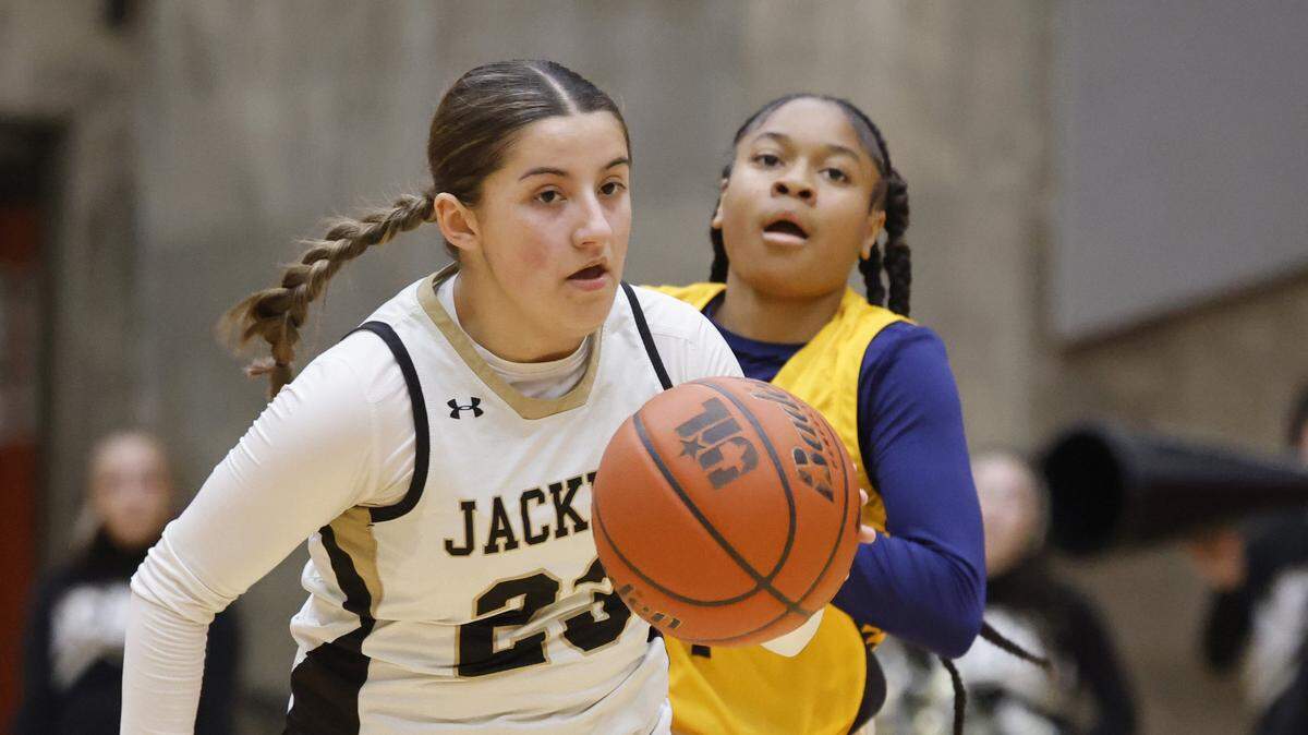 Cleburne guard Alyssa Franklin (23) brings the ball down court ahead of Arlington Heights guard Hope West (1) during the first half of the UIL 5A D1 girls bi-district championship basketball game at Wilkerson Greines Activity Center in Fort Worth, Texas, Monday Feb. 16, 2026.