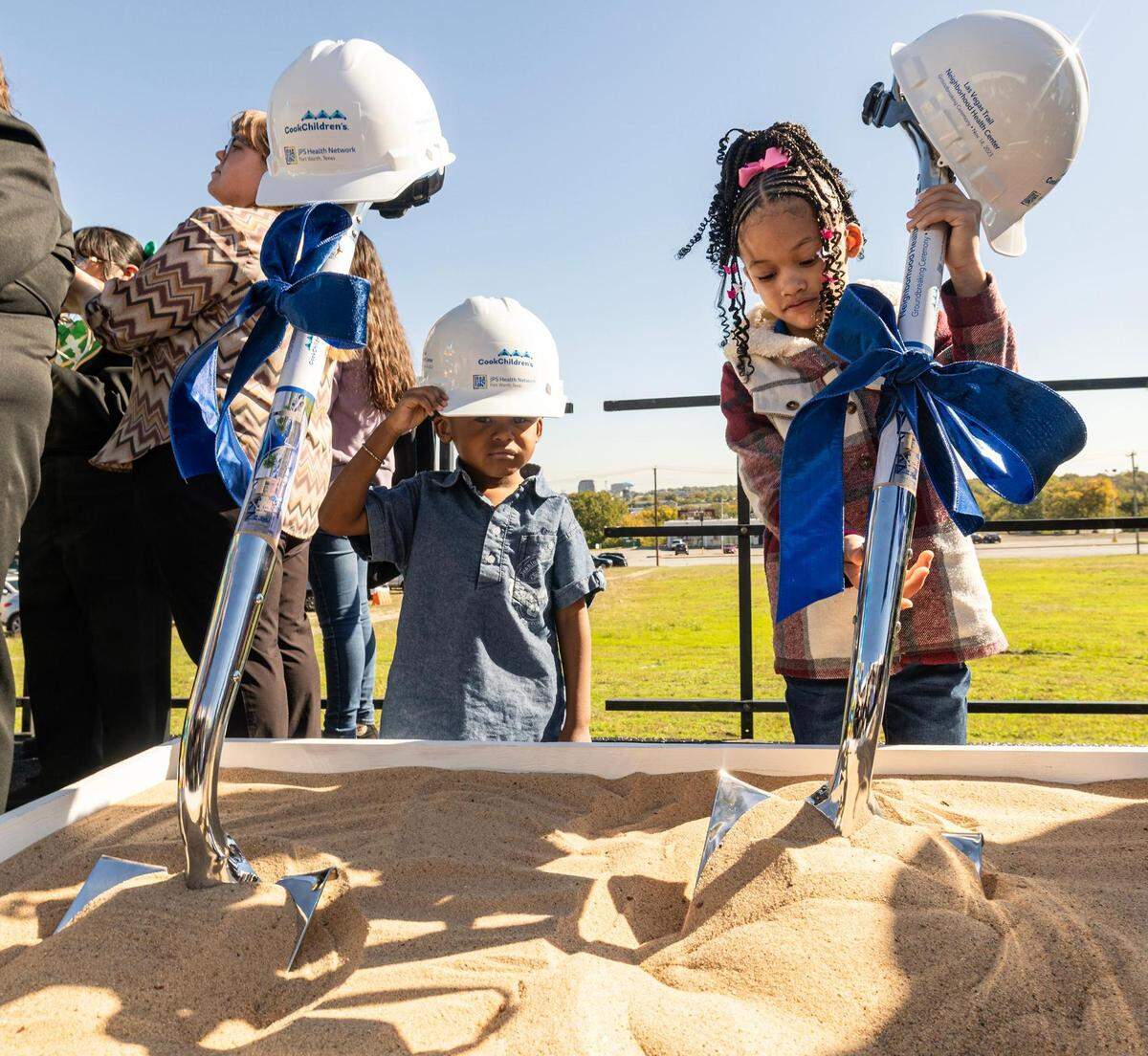 Western Hills Pre-K students Marques Cook, 4, and Peyton Arbell, 7, join in participating in the groundbreaking ceremony for the Las Vegas Trail Neighborhood Health Center in Fort Worth on Tuesday, Nov. 14, 2023.