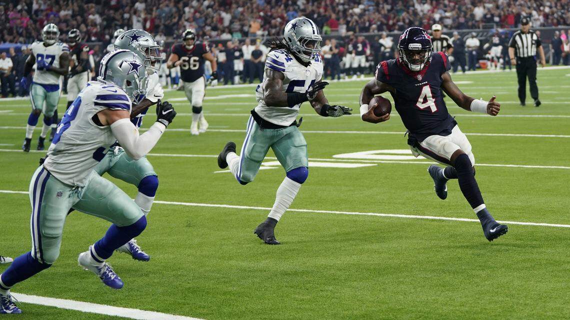 Houston Texans quarterback Deshaun Watson is stopped short of the end zone by Dallas Cowboys linebacker Jaylon Smith, middle, and Jeff Heath, left, in the first half Sunday night at NRG Stadium.