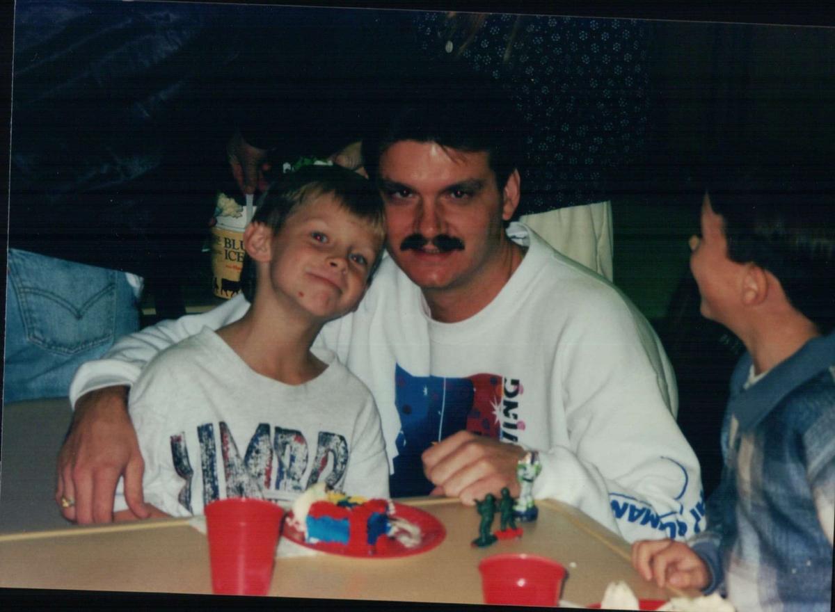 Jordan Hightower (left) poses for a photo with his father, Walter Hightower (right), in this old family photo. Walter said on Thursday morning he was relieved to learn a man was arrested in connection with the killing of Jordan early Sunday during a robbery at a south Arlington EZ-Mart.