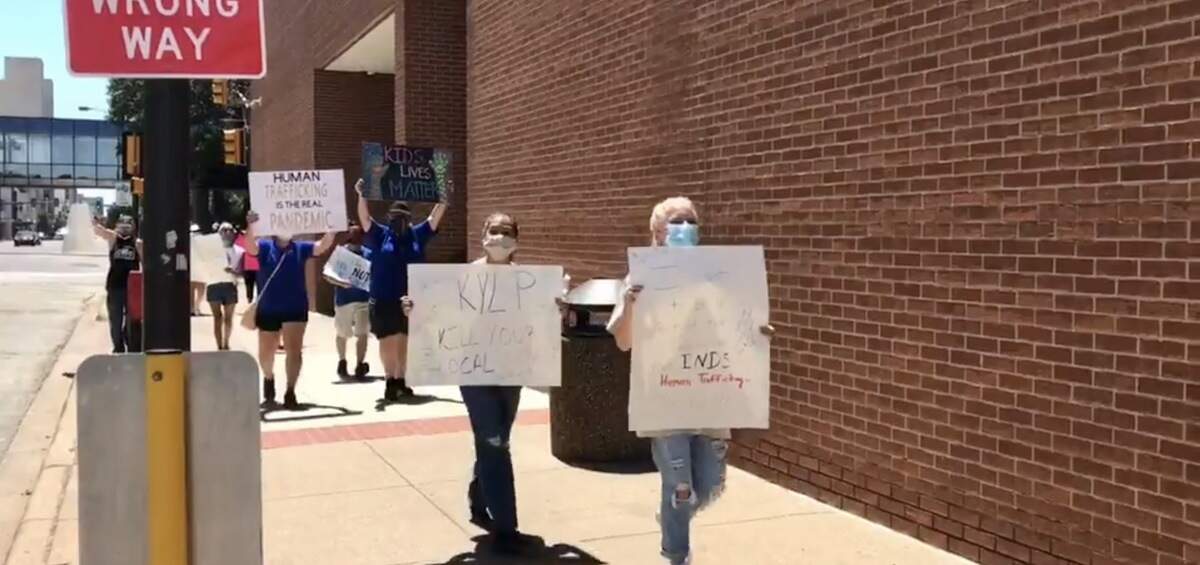 A QAnon rally at the Tarrant County courthouse featured signs about killing pedophiles and “Pizzagate is real.”