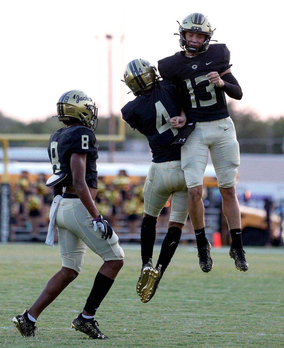 Cleburne defensive back Keon Long (4) and quarterback Landry Shields (13) celebrate after Long’s interception against Weatherford during the first half, Friday night, September 10, 2021 played at Yellow Jacket Stadium in Cleburne, TX. (Steve Nurenberg Special to the Star-Telegram)