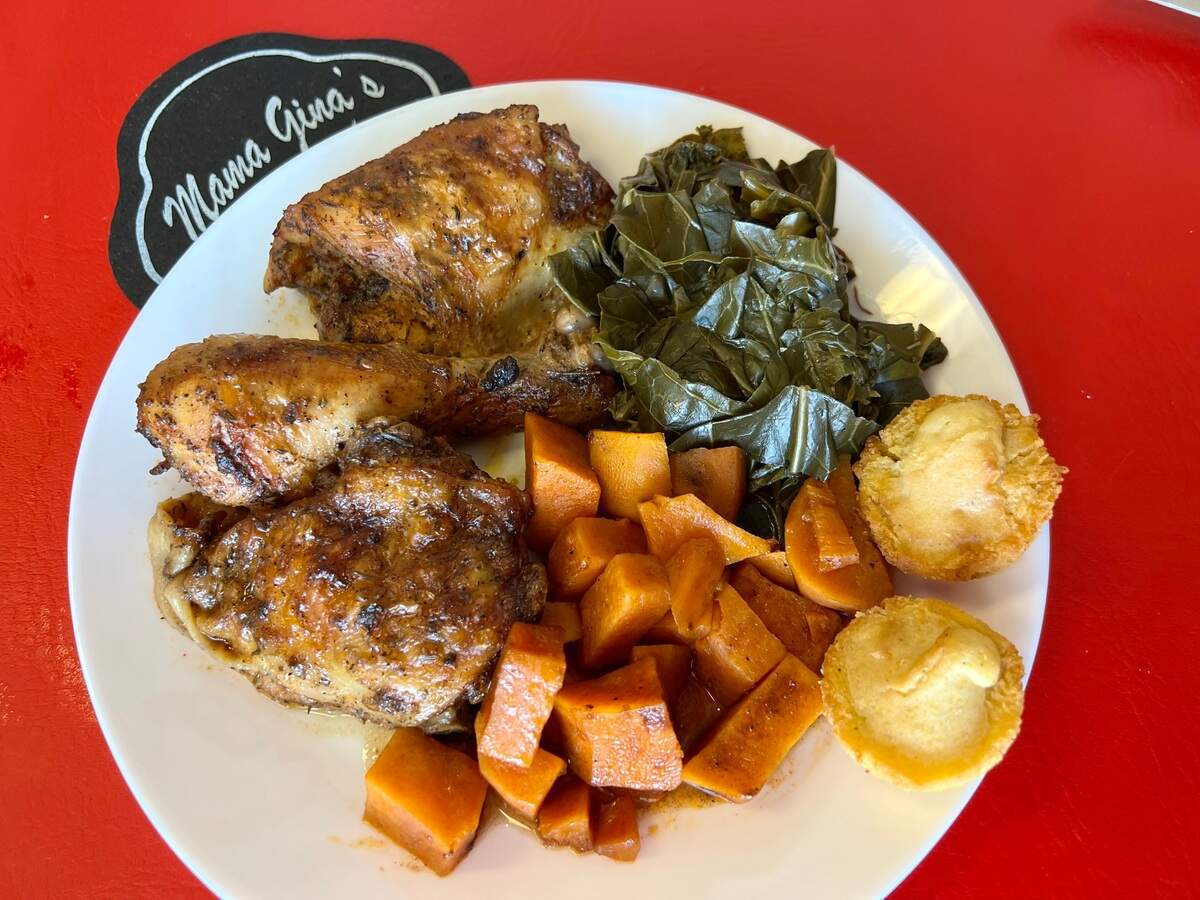 Baked chicken, sweet potatoes and collard greens at Mama Gina’s.