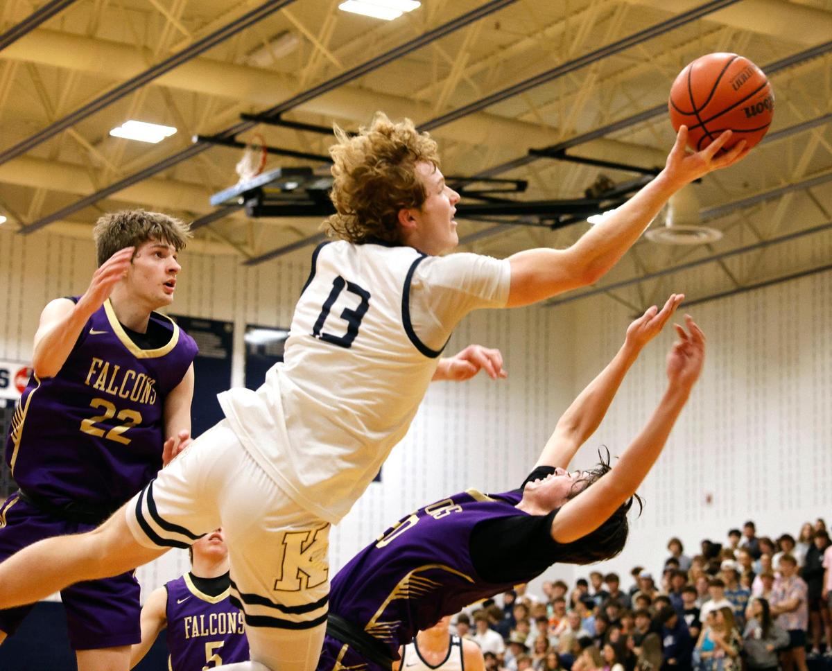 Keller point guard Brooks Bahr (13) puts in two over Timber Creek forward Colton Thorpe (20) in the second period of a high school basketball game in the Keller High School gym in Keller Texas, Friday, Feb. 02, 2024.