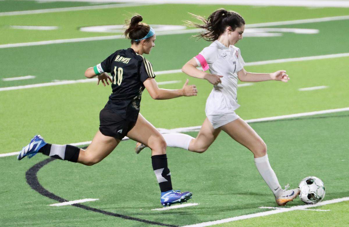 Colleyville Heritage sophomore midfielder Brielle McDaniel dribbles in a district game against Birdville at Birdville High School in North Richland Hills, Texas, on Friday, March 7, 2025.