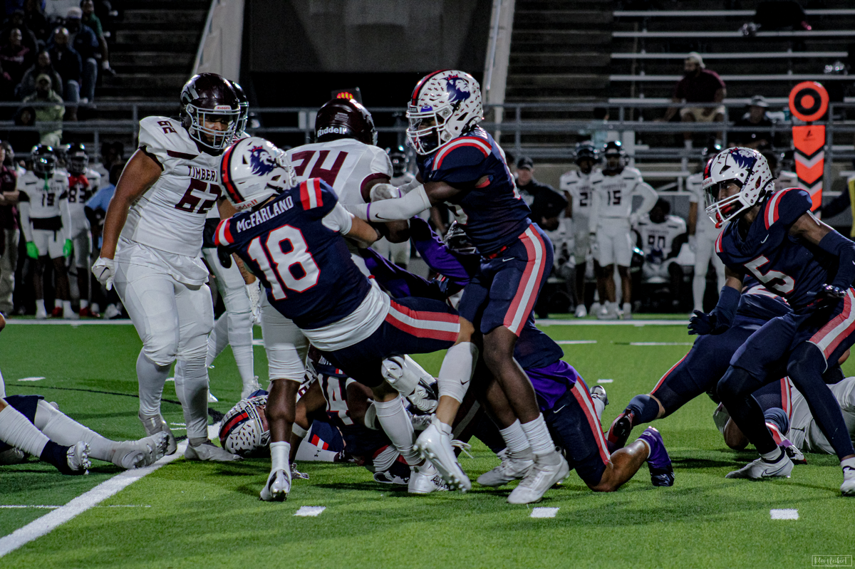 Richland linebacker Ty McFarland (18) tries to bring down Mansfield Timberview running back Demaury Moore (24) with the help of some friends on Friday, October 27, 2023 at Birdville Fine Arts/Athletics Complex in North Richland Hills, Texas.
