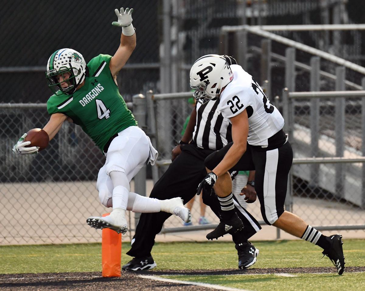 Southlake Carroll’s TJ McDaniel, left leaps past Permian’s Chase Stell for a 56 yard touchdown run to take a 7-0 lead in the first quarter of Friday’s September 14, 2018 football game at Daragon Stadium in Southlake. Special/Bob Haynes