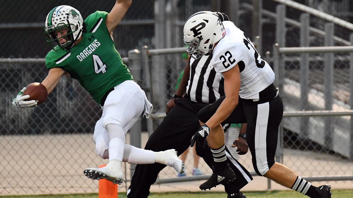 Southlake Carroll’s TJ McDaniel, left leaps past Permian’s Chase Stell for a 56 yard touchdown run to take a 7-0 lead in the first quarter of Friday’s September 14, 2018 football game at Daragon Stadium in Southlake. Special/Bob Haynes
