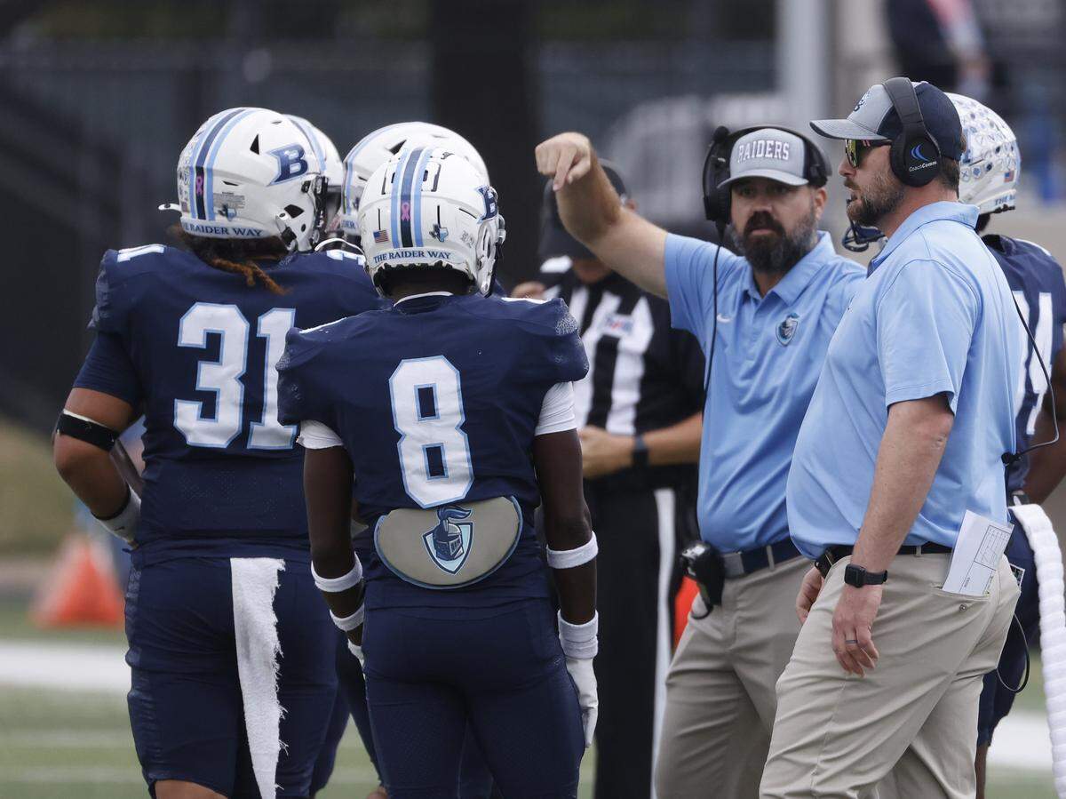 L.D. Bell head coach TJ Dibble talks to the team during a time out during the first half of a UIL football game between Carroll and L.D. Bell at Pennington Field in Bedford, Texas, Friday, October, 24, 2025.
