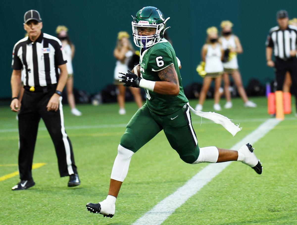 Arlington’s BJ Rogers takes a catch and run into the endzone for the touchdown to take a 13-0 over Mansfield in the first quarter of their football game Friday, September 25, 2020 at Globe Life Park in Arlington, Texas. Special/Bob Haynes