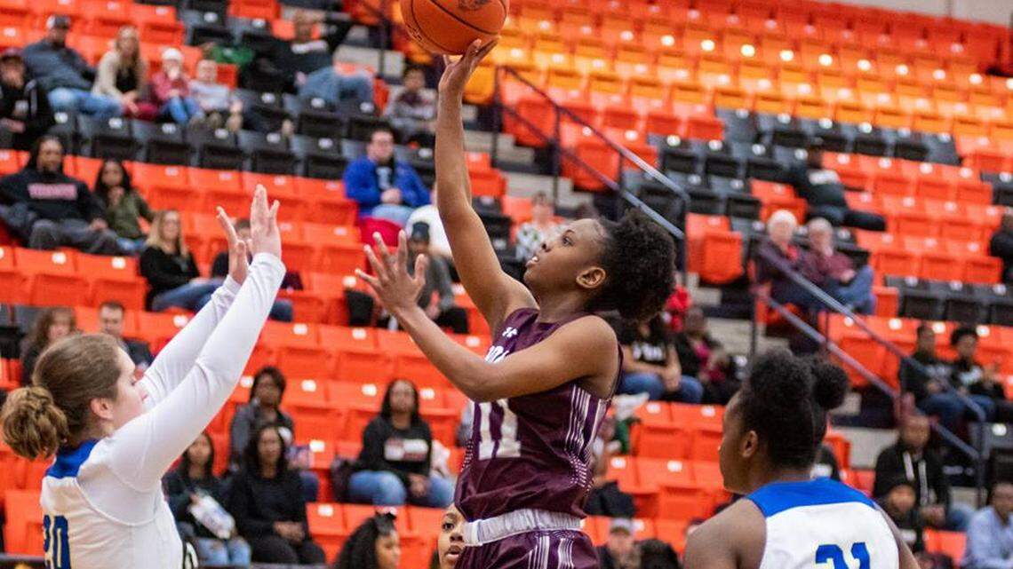 Timberview’s Kennedy Wilson scores past Boswell’s Jamie Garcia (left) and Laylah Davis in a regional quarterfinal game, Monday Feb. 18, 2019 from Aledo HS. Timberview won 68-46.